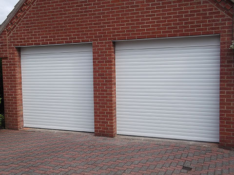 two white steel roll up garage doors installed in Norfolk