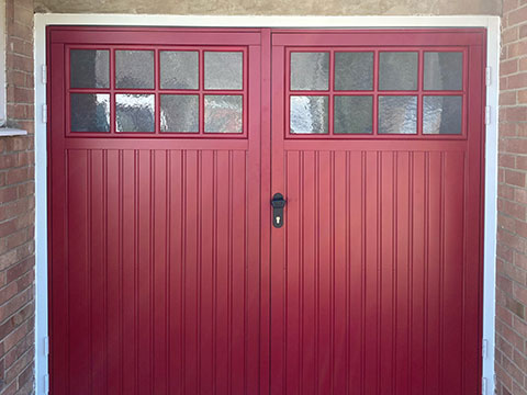 Red steel side-hung garage door in Norfolk
